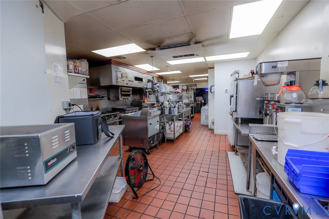 700 Jordan Point Road, North Prince George, VA 23860 Commercial kitchen space featuring stainless steel work surfaces, a stainless steel exhaust hood, tile flooring, and integrated recessed lighting