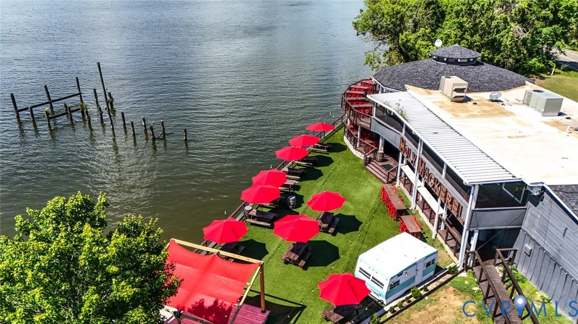 700 Jordan Point Road, North Prince George, VA 23860 Waterfront property featuring a multi-level deck, direct bulkhead access, and an expansive lawn area