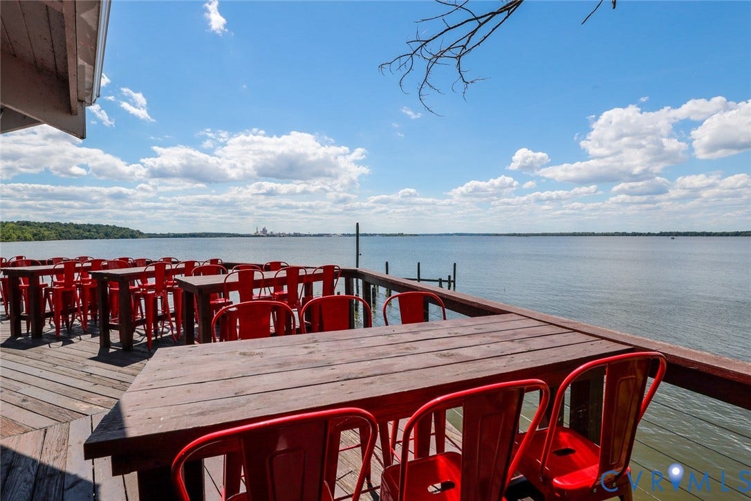 700 Jordan Point Road, North Prince George, VA 23860 Waterfront deck featuring wood-plank flooring and a wooden railing