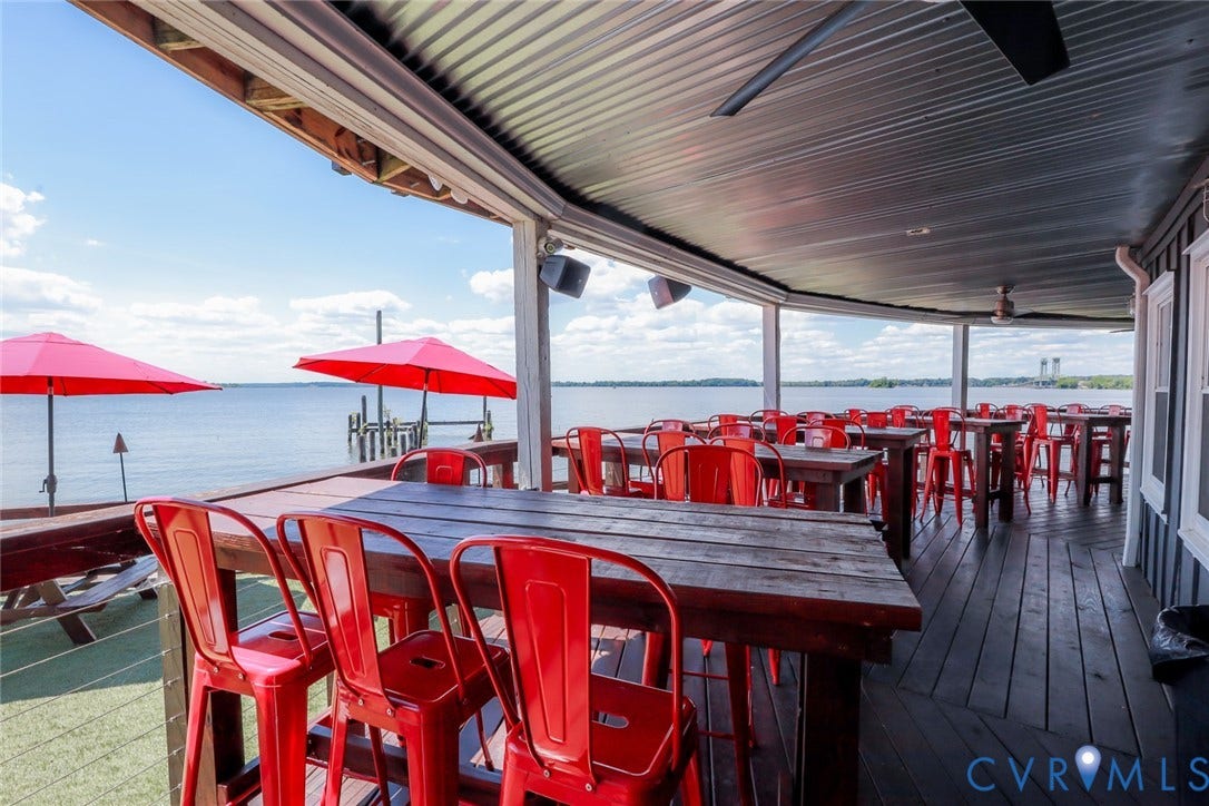 700 Jordan Point Road, North Prince George, VA 23860 Covered waterfront patio featuring wood decking, a metal ceiling, and cable railing