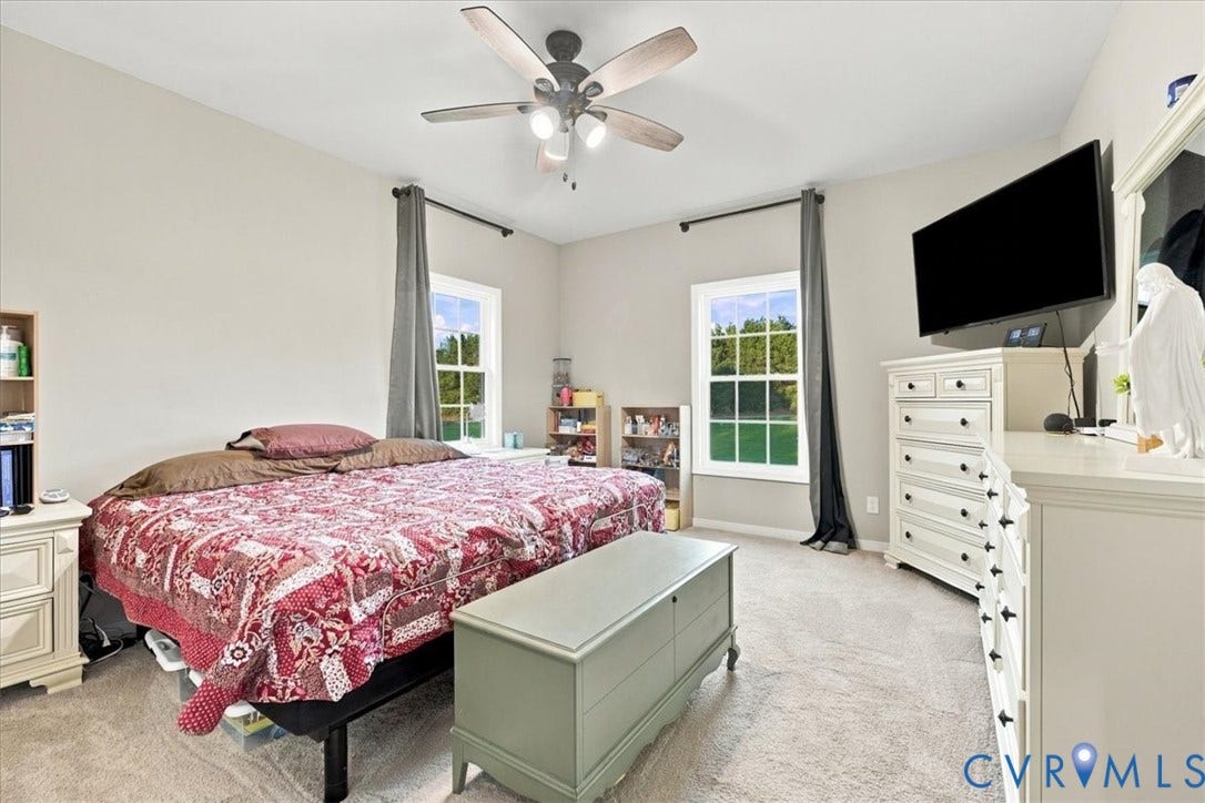 11880 Fosters Lane, Amelia, VA 23002 Neutral wall tones, wall-to-wall carpeting, ceiling fan with integrated lighting, and multiple windows providing natural light