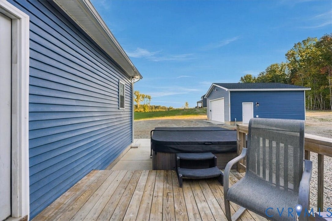 11880 Fosters Lane, Amelia, VA 23002 Blue siding exterior featuring a gable roof, covered entryway, and a gravel driveway