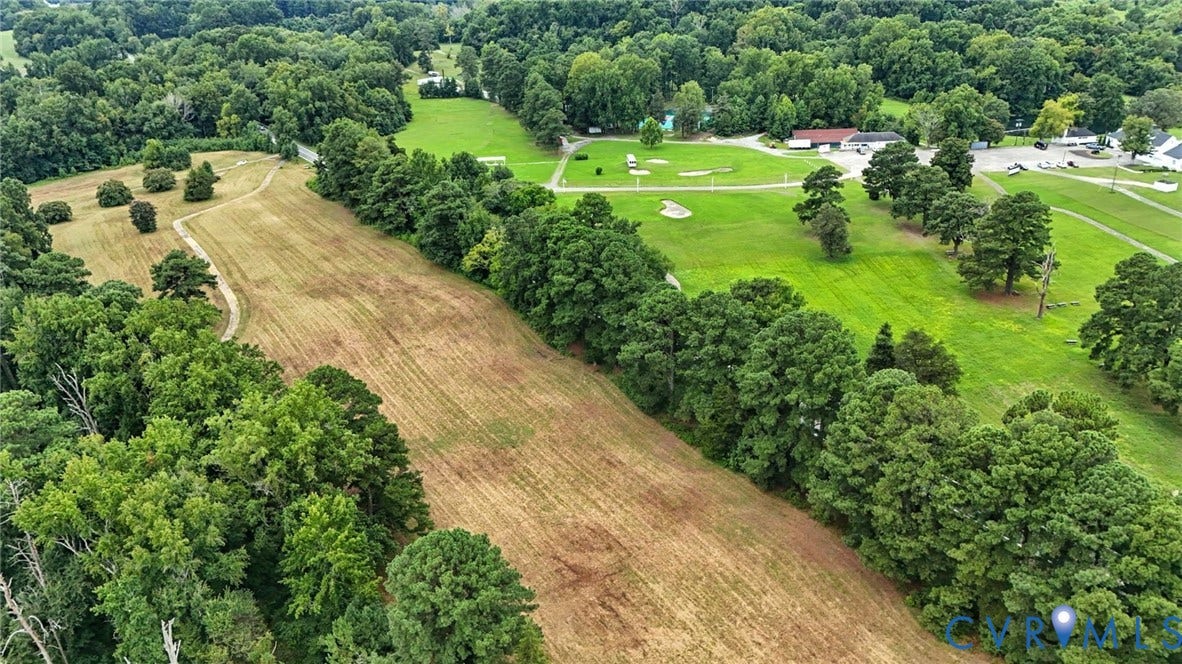 1100 Jordan Point Road, North Prince George, VA 23860 Expansive acreage featuring mature tree lines, open meadow terrain, and paved pathways