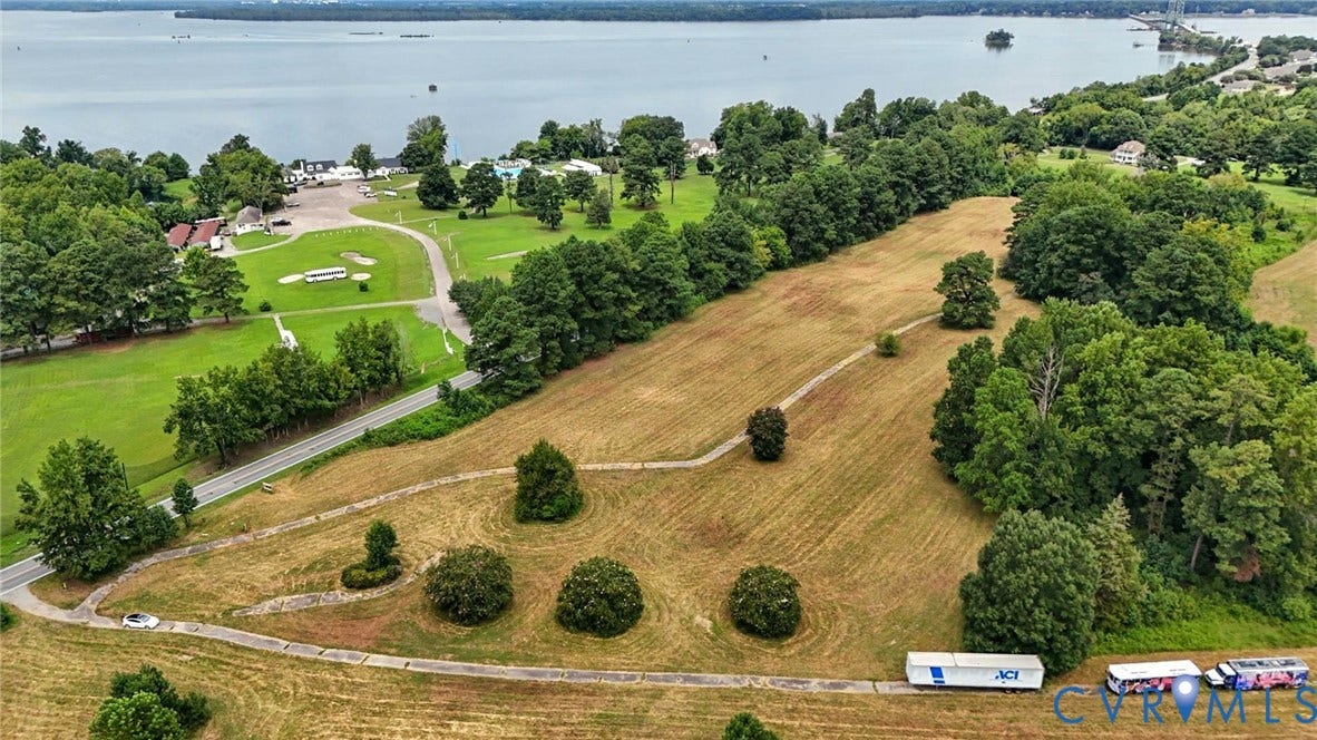 1100 Jordan Point Road, North Prince George, VA 23860 Expansive parcel of land featuring mature trees, rolling topography, and paved pathways