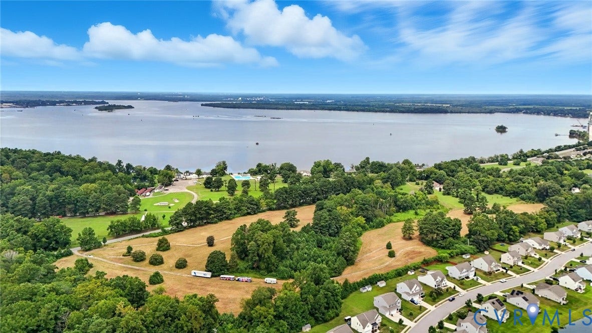 1100 Jordan Point Road, North Prince George, VA 23860 Aerial perspective featuring expansive waterfront acreage, mature tree canopy, and established neighborhood infrastructure