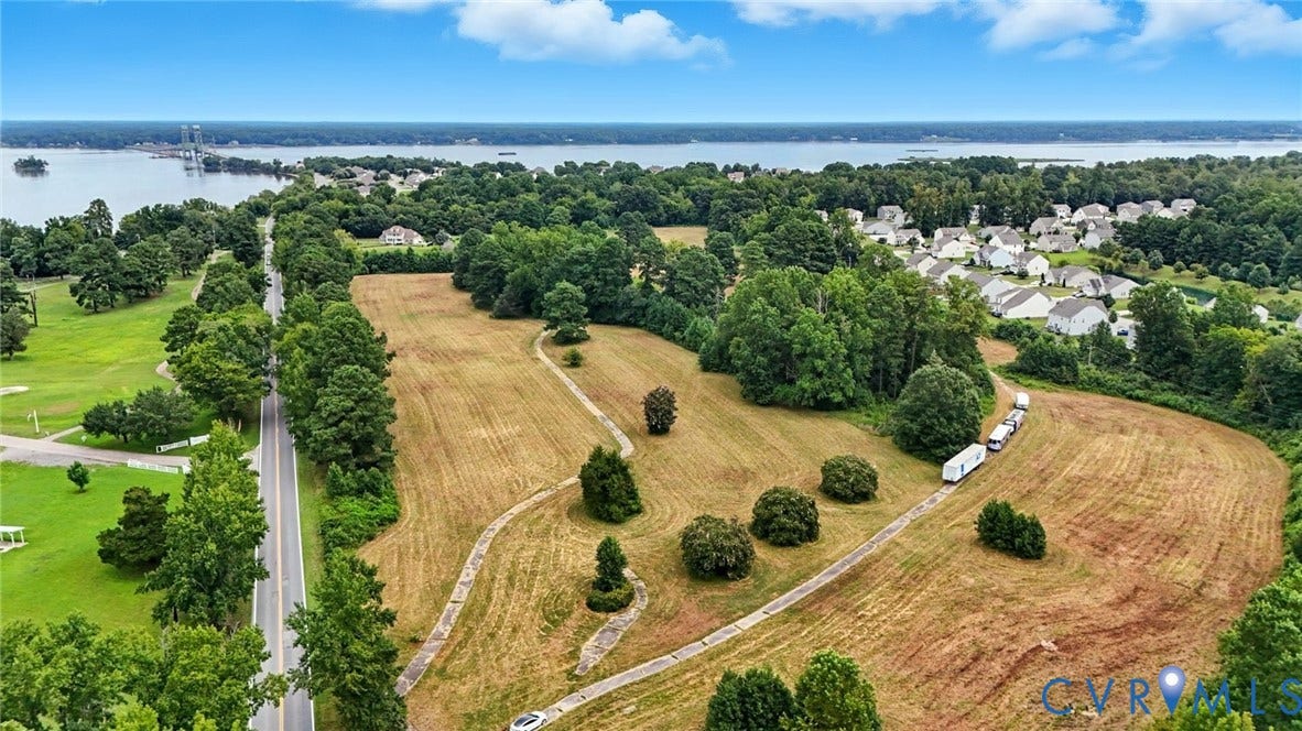 1100 Jordan Point Road, North Prince George, VA 23860 Expansive waterfront parcel featuring mature trees, cleared open land, paved pathways, and direct access to major roadways
