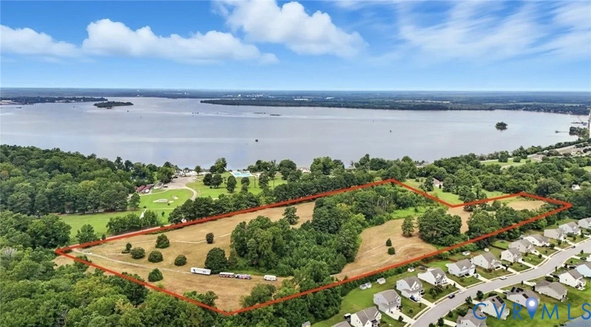 1100 Jordan Point Road, North Prince George, VA 23860 Aerial view of expansive, cleared land featuring mature trees and direct proximity to the waterfront