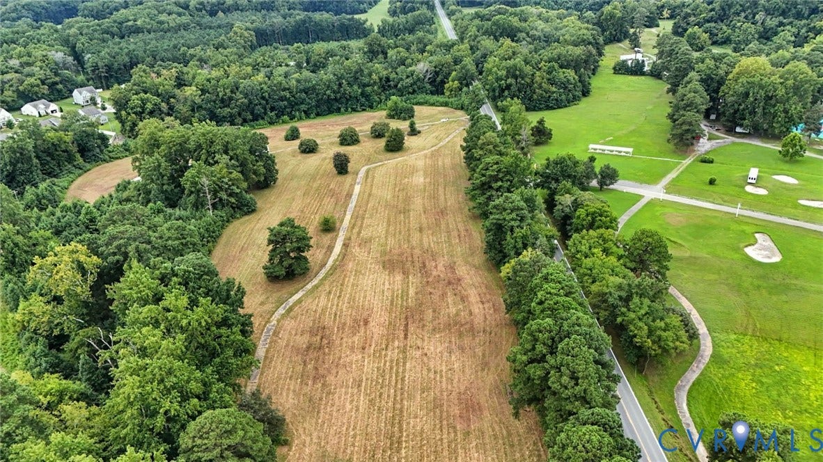 1100 Jordan Point Road, North Prince George, VA 23860 Expansive cleared parcel featuring mature tree buffers, defined perimeter boundaries, and direct access to an asphalt paved road