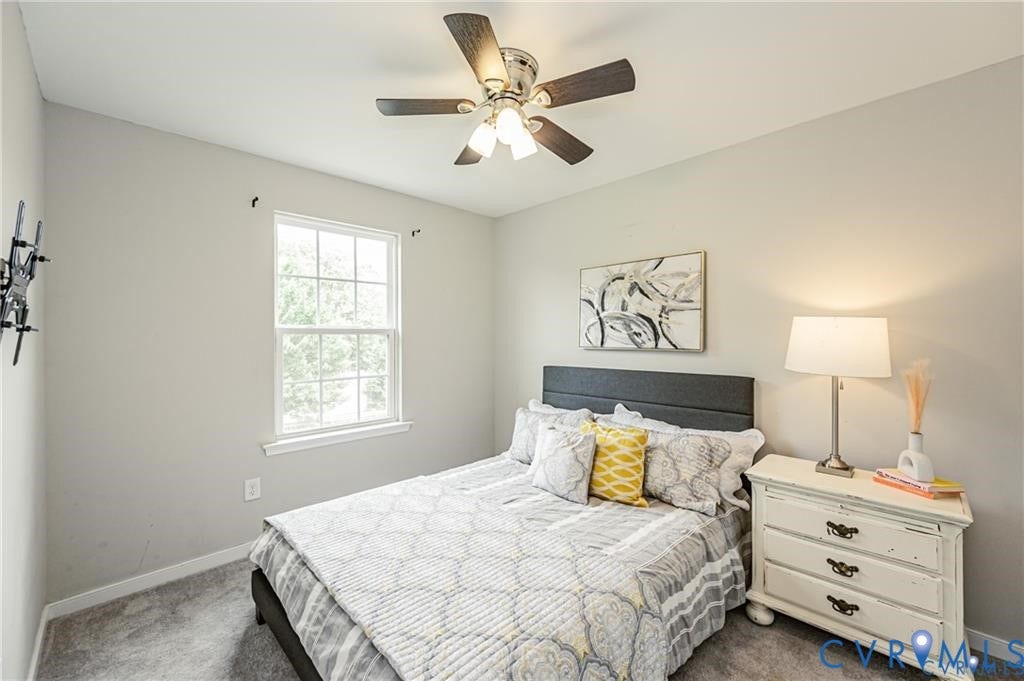 1324 Stone Ridge Park Loop, Henrico, VA 23228 Neutral wall tones, wall-to-wall carpeting, double-hung window, and a multi-blade ceiling fan with integrated light fixture