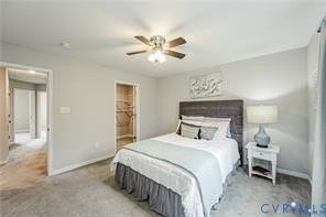 1324 Stone Ridge Park Loop, Henrico, VA 23228 Neutral-toned room featuring a wood-panel headboard, recessed closet shelving, and a ceiling-mounted light fixture with a three-blade fan