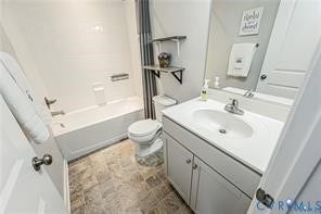 1324 Stone Ridge Park Loop, Henrico, VA 23228 Bathroom featuring a single-sink vanity with white countertop, chrome faucet, tiled shower-tub surround, dual wall-mounted shelving, and stone-finish flooring