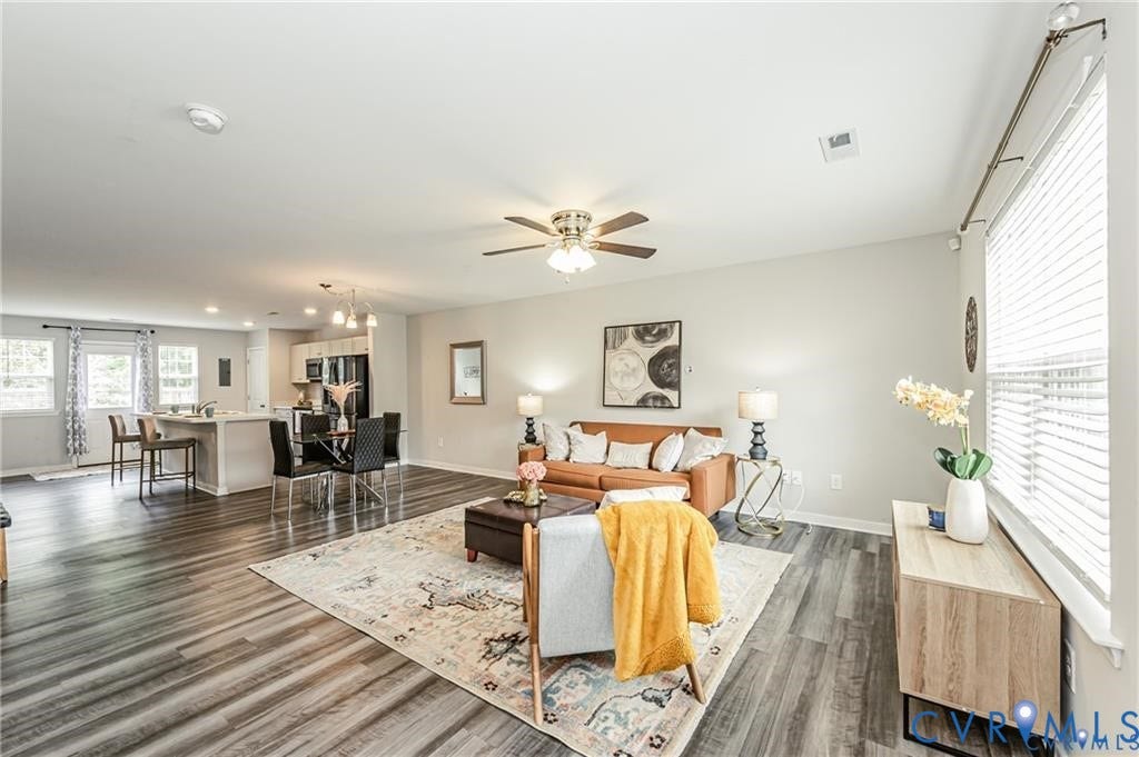 1324 Stone Ridge Park Loop, Henrico, VA 23228 Open-concept interior featuring wood-finish flooring, recessed lighting, a ceiling fan, and large windows with horizontal blinds