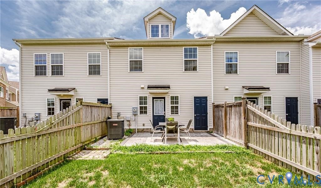 1324 Stone Ridge Park Loop, Henrico, VA 23228 Light-colored siding exterior with a shingled roof, featuring a private fenced-in yard and a paved patio area