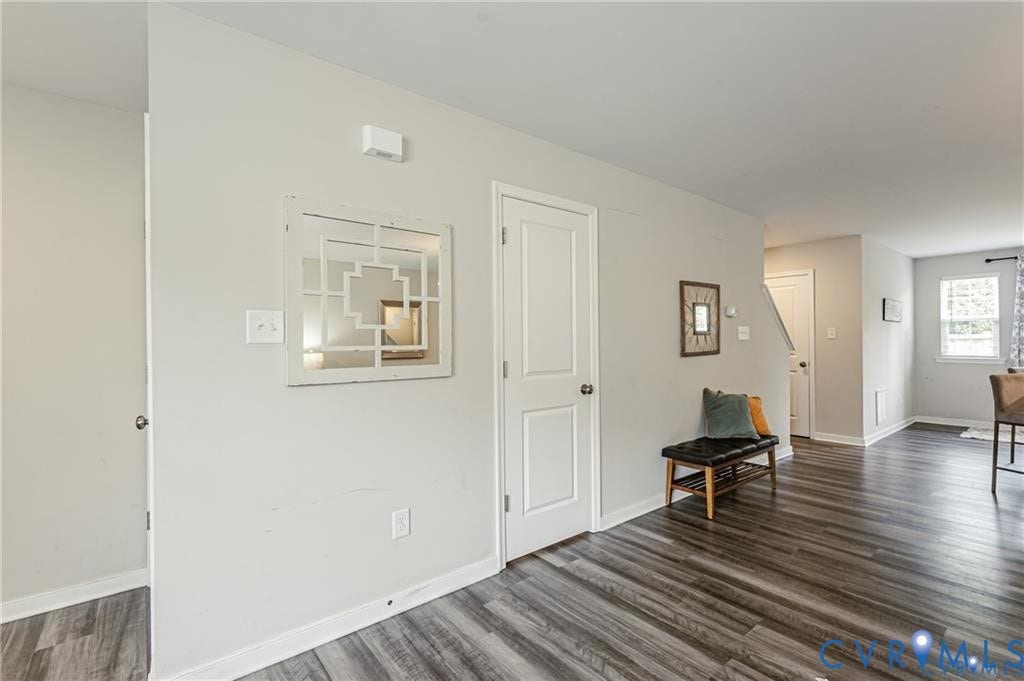 1324 Stone Ridge Park Loop, Henrico, VA 23228 Wood-finish flooring, neutral wall tones, multi-panel interior door, and window with natural light