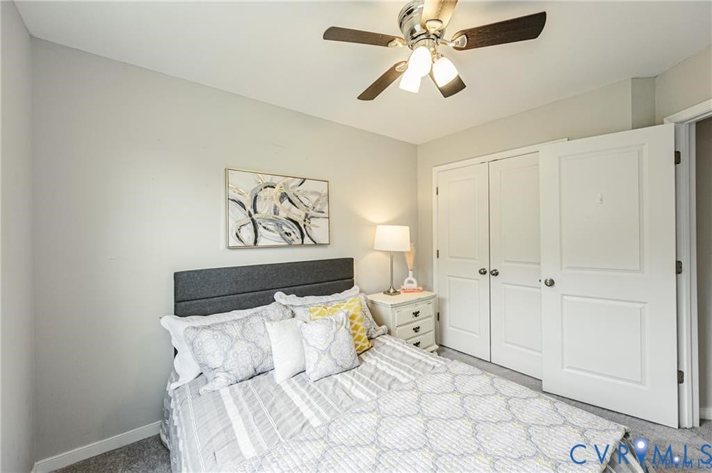1324 Stone Ridge Park Loop, Henrico, VA 23228 Neutral-toned interior featuring carpeted flooring, a ceiling fan with integrated lighting, and a dual-panel closet door