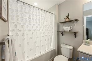 1324 Stone Ridge Park Loop, Henrico, VA 23228 Bathroom featuring a built-in shower-tub combination, wall-mounted open shelving, a standard toilet, and a vanity with a countertop basin