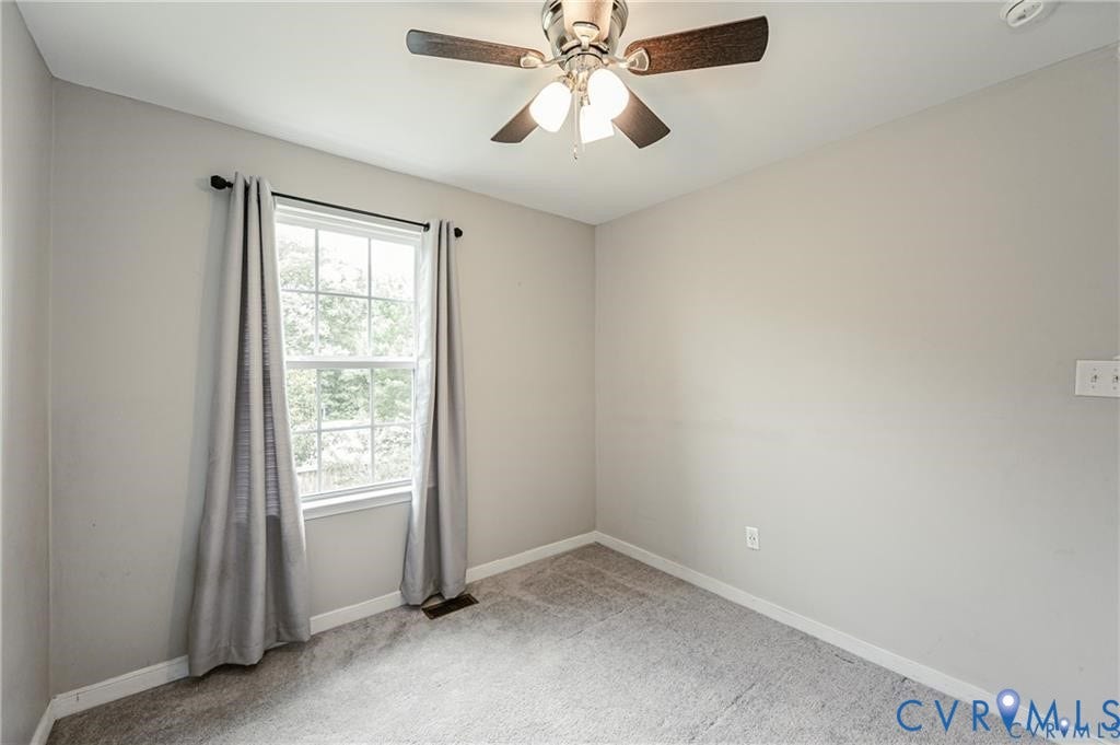1324 Stone Ridge Park Loop, Henrico, VA 23228 Neutral-toned walls, wall-to-wall carpeting, multi-pane window with natural light, and a ceiling-mounted light fixture with a fan
