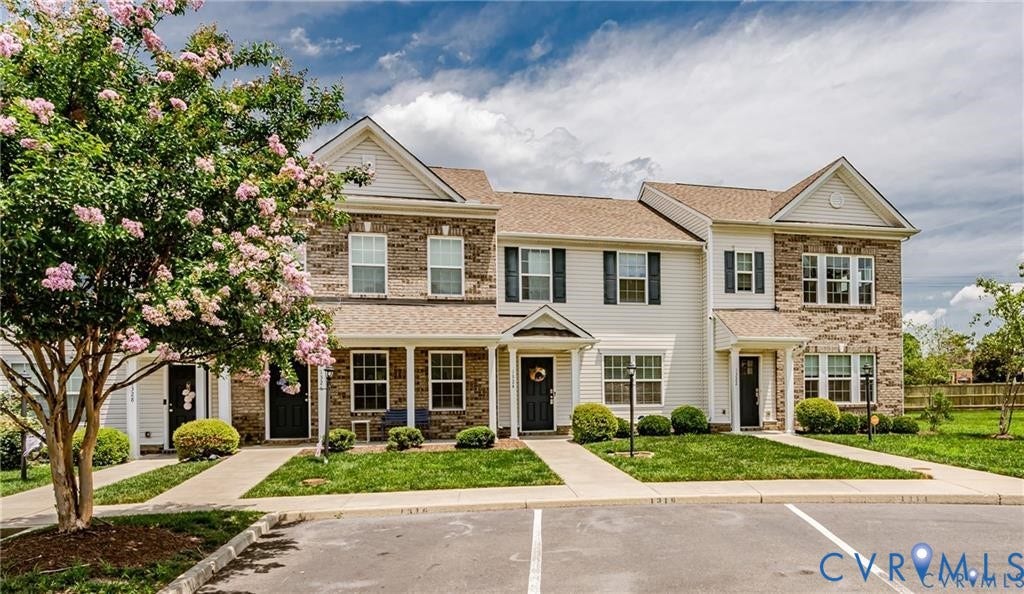 1324 Stone Ridge Park Loop, Henrico, VA 23228 Multi-unit residence featuring a brick and vinyl siding exterior, asphalt shingle roof, covered front porches, and manicured lawn