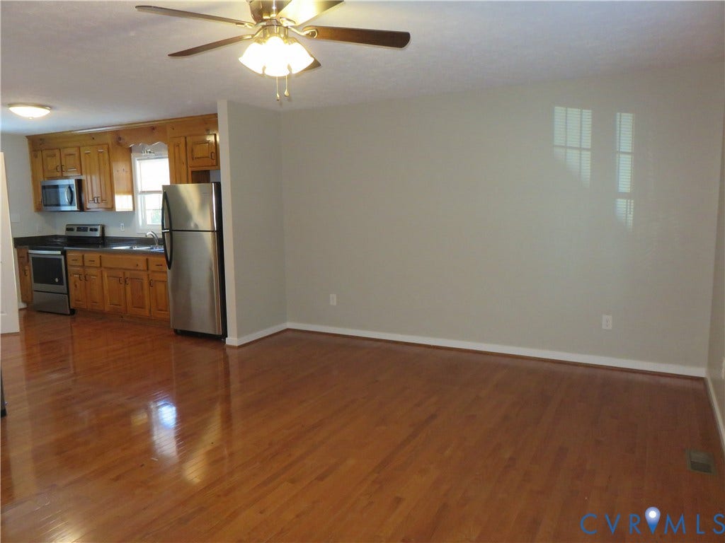 14 N Kalmia Avenue, Henrico, VA 23075 Kitchen featuring wood cabinetry, stainless steel appliances, wood-finish flooring, and a ceiling-mounted light fixture