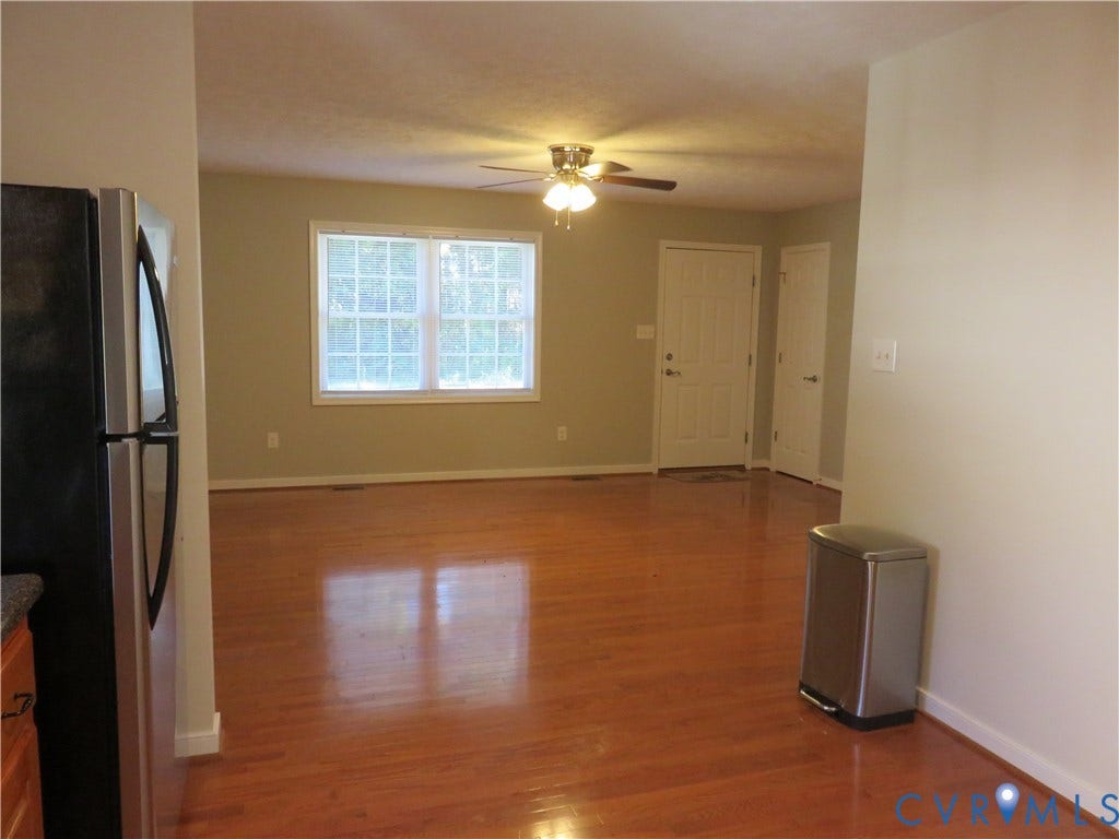 14 N Kalmia Avenue, Henrico, VA 23075 Living area featuring wood-finish flooring, a multi-light ceiling fan, and double-hung windows with grid detailing