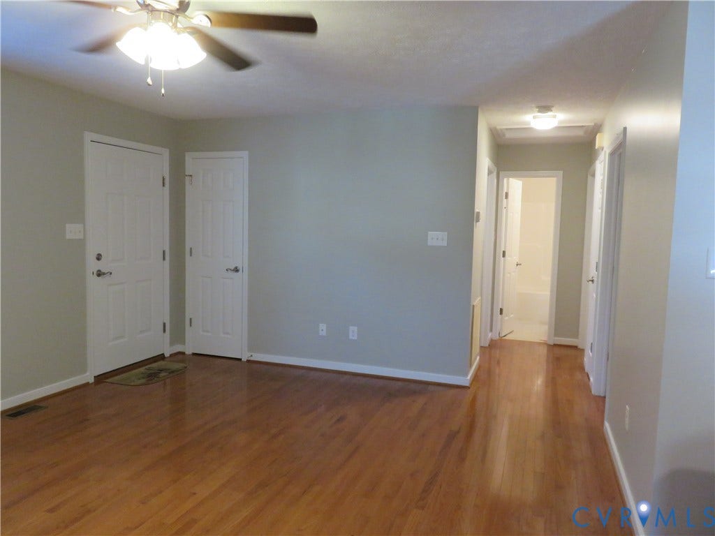 14 N Kalmia Avenue, Henrico, VA 23075 Wood-finish flooring, ceiling fan with integrated lighting, multi-panel doors, and neutral wall tones