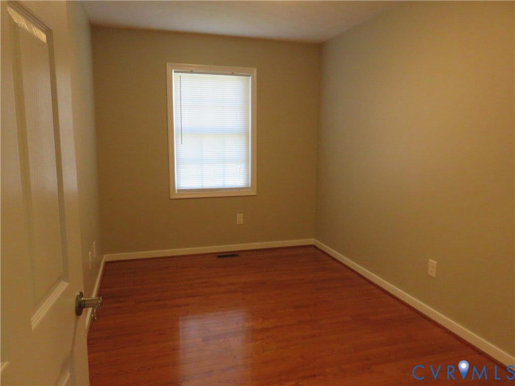 14 N Kalmia Avenue, Henrico, VA 23075 Room with wood-finish flooring, neutral-toned walls, and a single window featuring integrated blinds