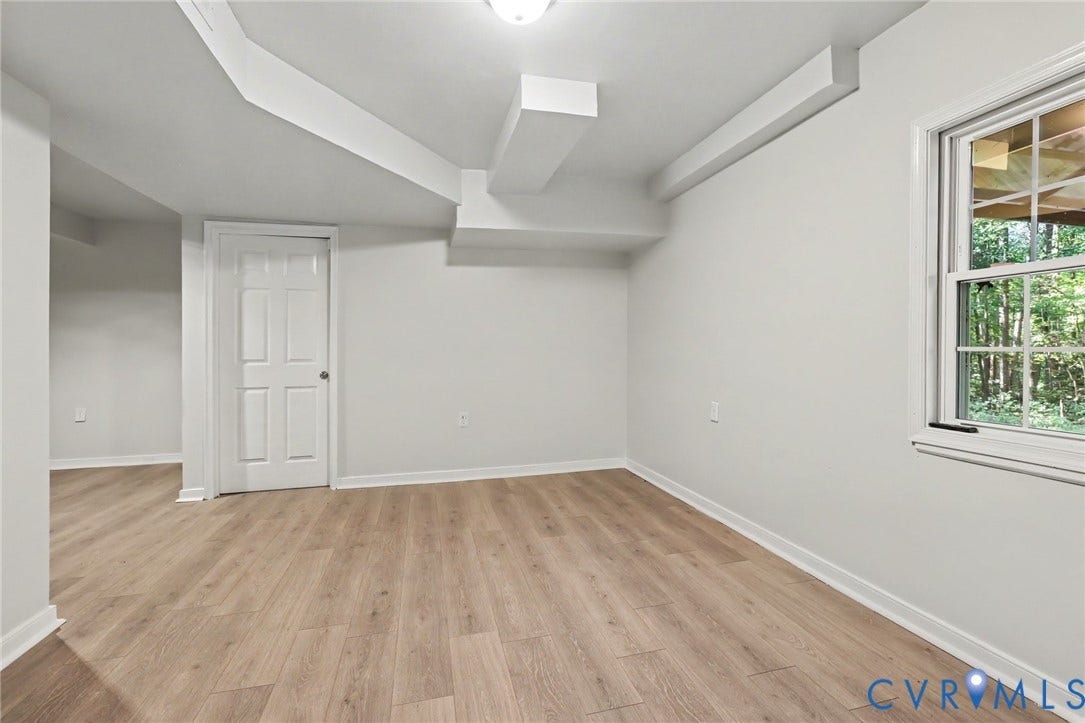 2511 Mill Road, Powhatan, VA 23139 Room interior featuring wood-finish flooring, a single-hung window, and a multi-panel interior door