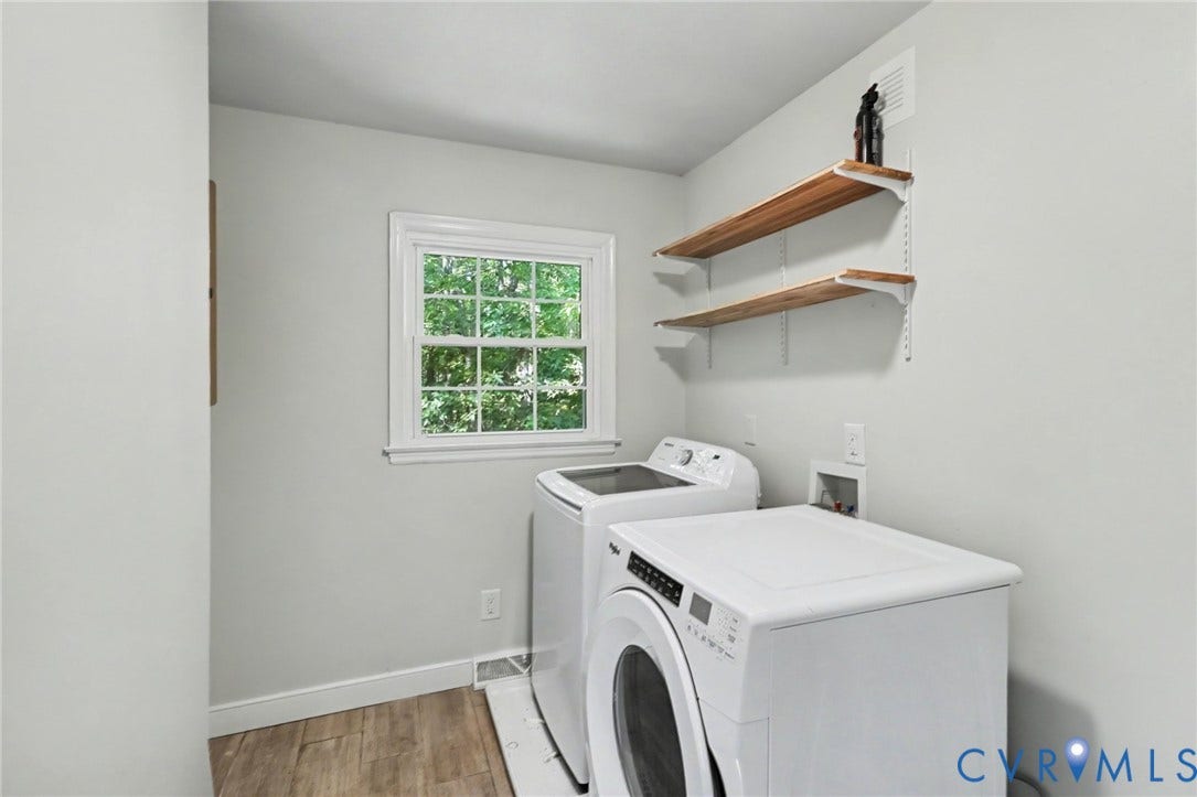2511 Mill Road, Powhatan, VA 23139 Laundry room featuring wood-finish flooring, double-hung window, and wall-mounted wood shelving