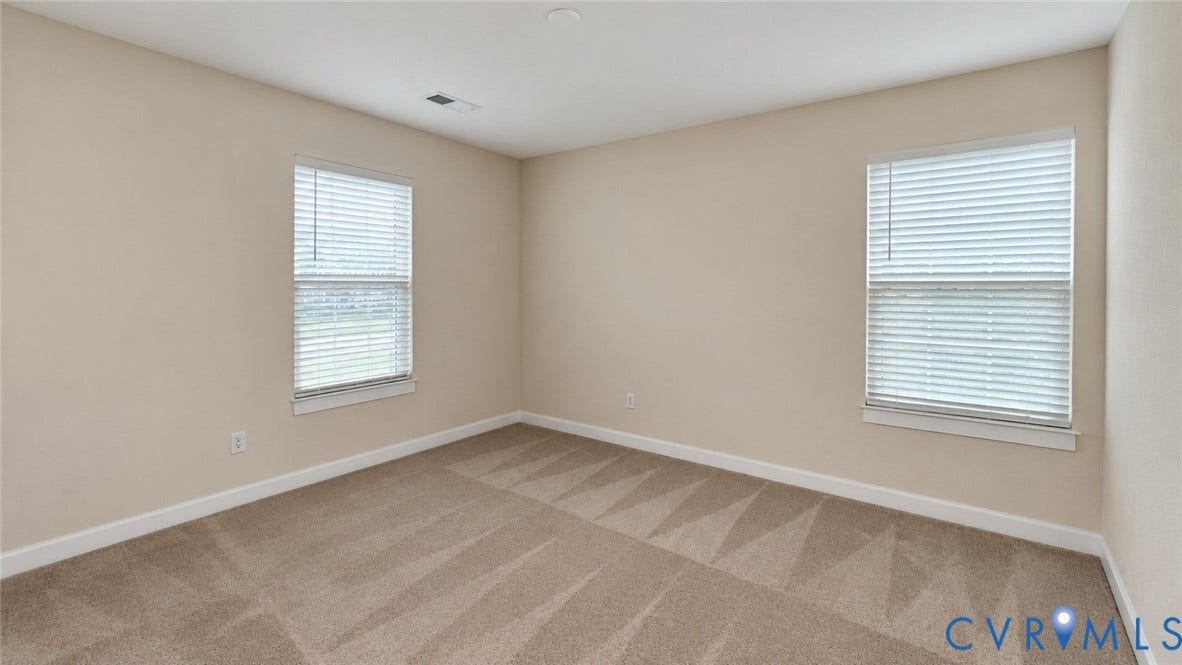 11500 Amara Drive, Chesterfield, VA 23838 Neutral-toned interior space featuring wall-to-wall carpeting and two windows equipped with horizontal blinds