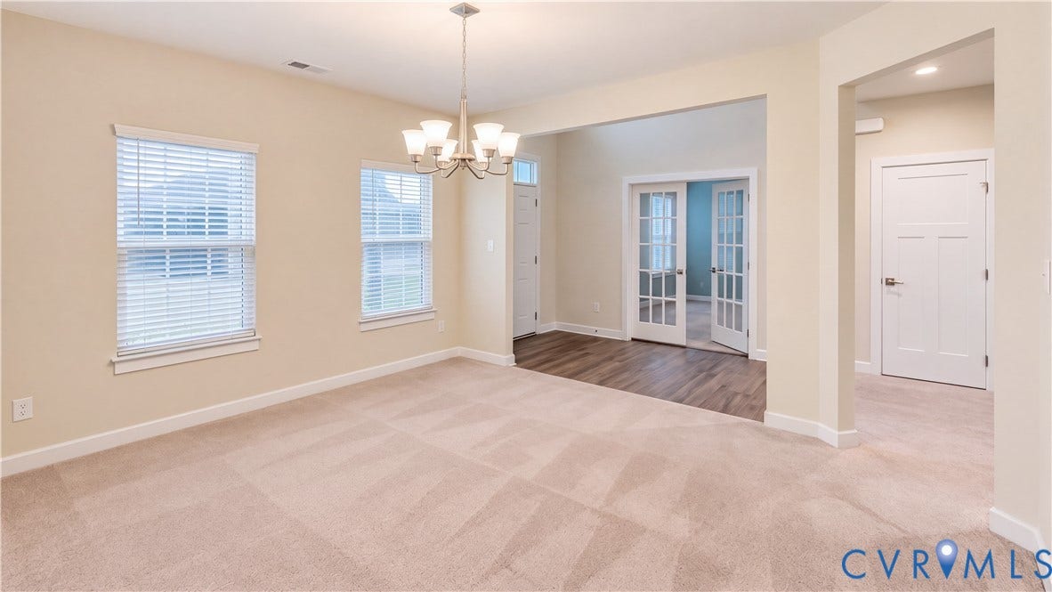 11500 Amara Drive, Chesterfield, VA 23838 Neutral-toned interior featuring wall-to-wall carpeting, wood-finish flooring, multi-pane French doors, and a multi-light chandelier