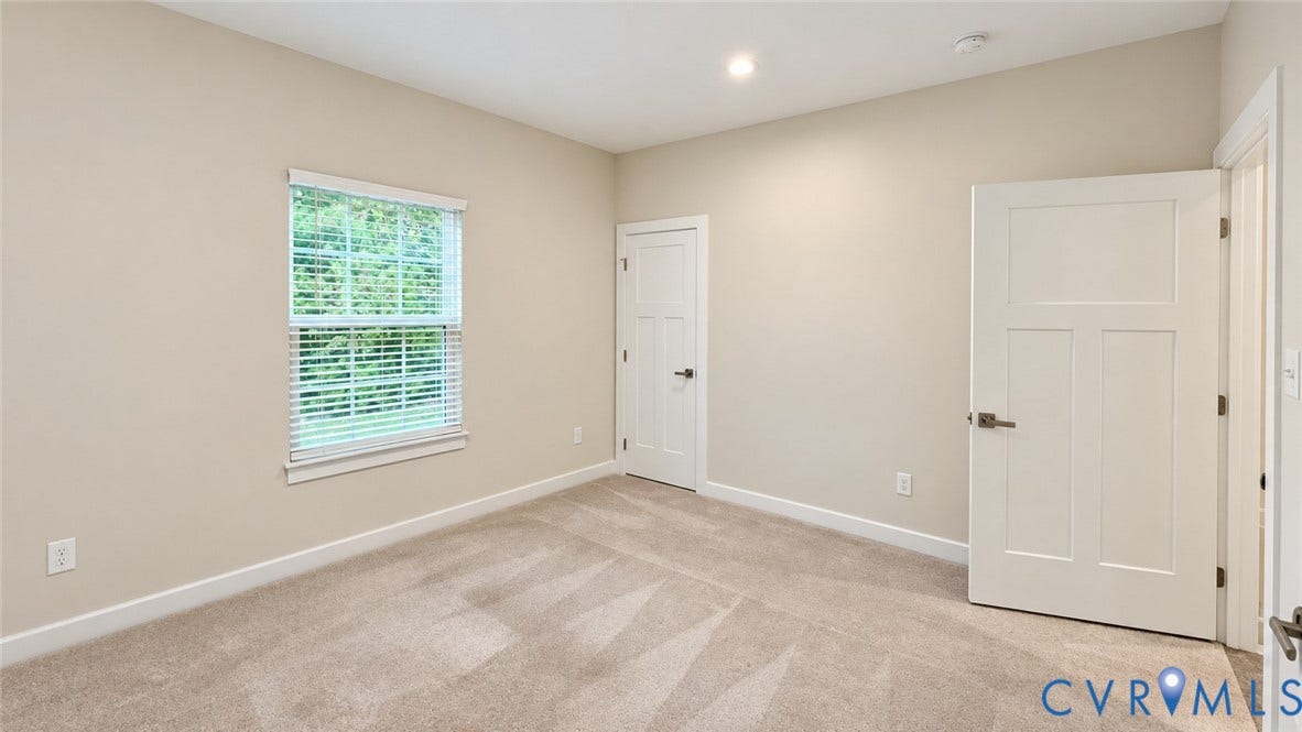 11500 Amara Drive, Chesterfield, VA 23838 Neutral-toned room featuring wall-to-wall carpeting, recessed ceiling lighting, a single-hung window with horizontal blinds, and two-panel shaker-style interior doors with brushed nickel hardware