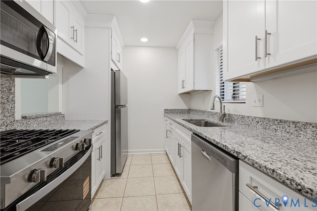 11947 W Briar Patch Drive, Chesterfield, VA 23113 Kitchen featuring white cabinetry, stone-surface countertops, tile flooring, stainless steel appliances, and a gooseneck faucet