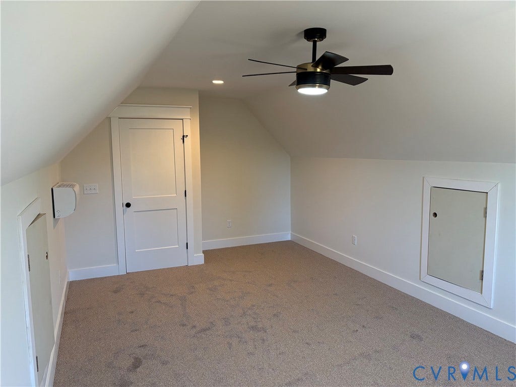15135 Lebanon, Parson's Retreat, Disputanta, VA 23842 Finished attic space featuring vaulted ceilings, neutral wall-to-wall carpeting, a multi-blade ceiling fan with integrated lighting, and two built-in access doors