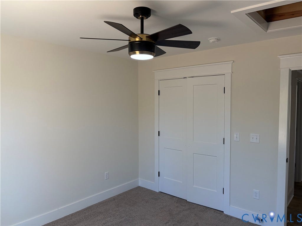 15135 Lebanon, Parson's Retreat, Disputanta, VA 23842 Modern six-blade ceiling fan with integrated LED lighting, white double-panel closet doors, and neutral wall-to-wall carpeting