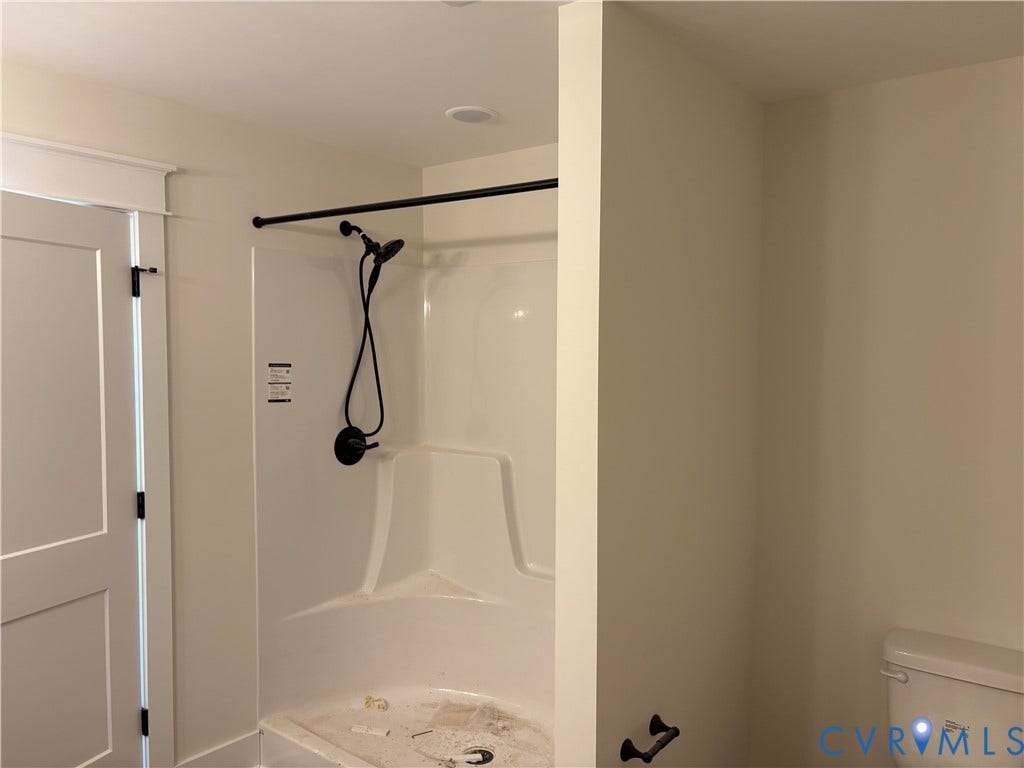 15135 Lebanon, Parson's Retreat, Disputanta, VA 23842 Shower enclosure with a white acrylic surround, handheld showerhead, matte black hardware, and recessed ceiling lighting