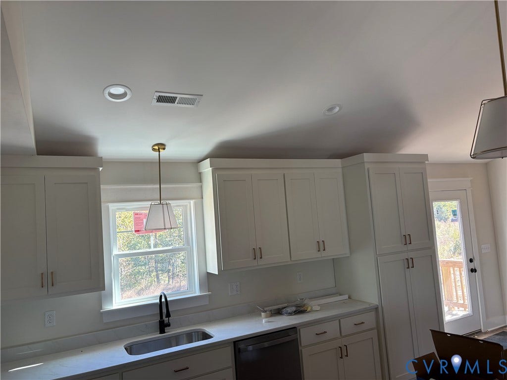 15135 Lebanon, Parson's Retreat, Disputanta, VA 23842 Kitchen featuring shaker-style cabinetry, matte black faucet with an undermount sink, stone-surface countertops, pendant lighting, and recessed ceiling lighting