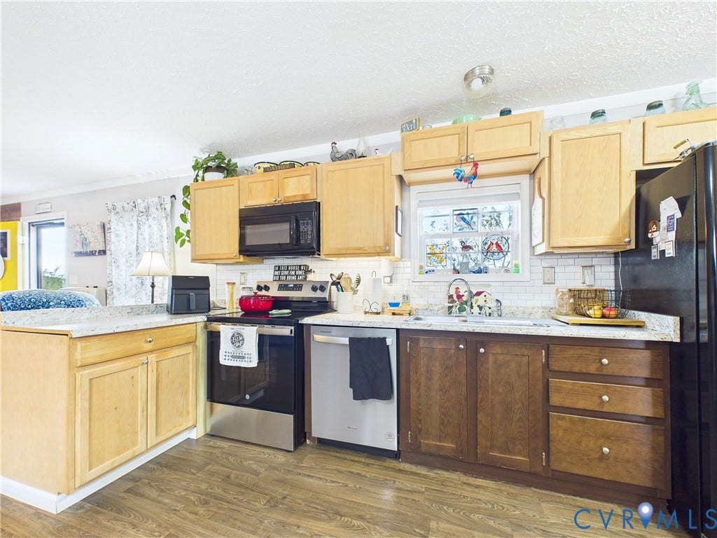 290 Western Lane, Appomattox, Appomattox, VA 24522 Kitchen featuring wood cabinetry, stone-finish countertops, subway tile backsplash, stainless steel dishwasher, and wood-finish flooring