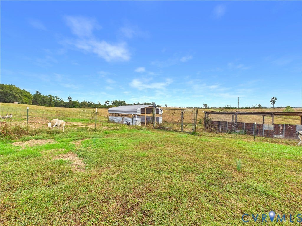290 Western Lane, Appomattox, Appomattox, VA 24522 Expansive pasture featuring fenced enclosures and metal-roofed storage structures