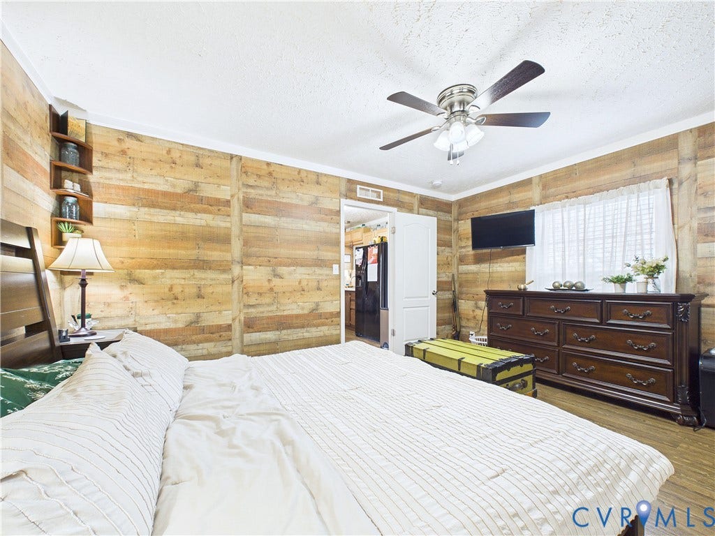 290 Western Lane, Appomattox, Appomattox, VA 24522 Horizontal wood-paneled walls, built-in corner shelving, and a ceiling fan with integrated lighting
