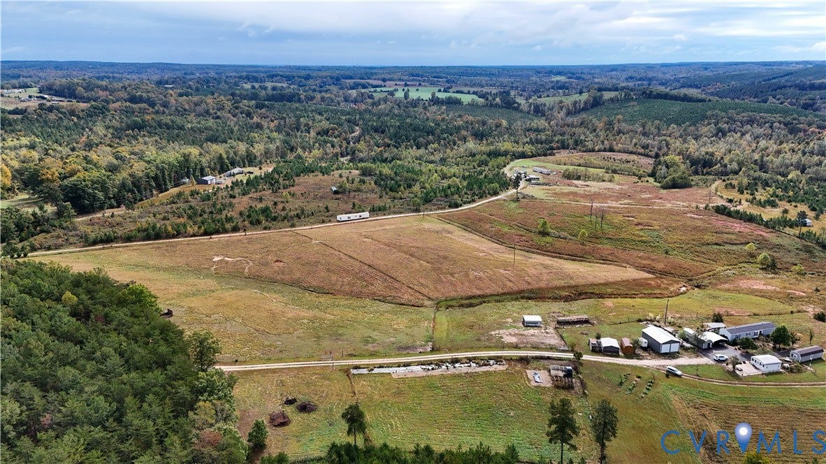 290 Western Lane, Appomattox, Appomattox, VA 24522 Expansive acreage featuring cleared pasture land, dense mature timber, and multiple outbuildings