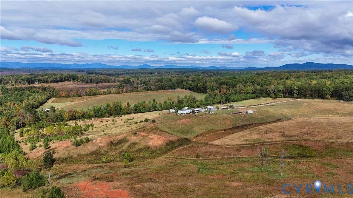 290 Western Lane, Appomattox, Appomattox, VA 24522 Expansive acreage featuring rolling open fields, mature woodland, multiple outbuildings, and mountain scenery
