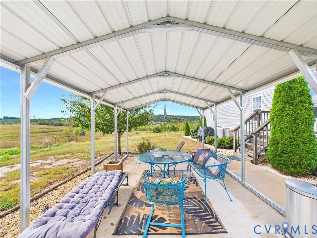 290 Western Lane, Appomattox, Appomattox, VA 24522 Covered patio featuring a metal roof structure, concrete flooring, and an expansive exterior outlook