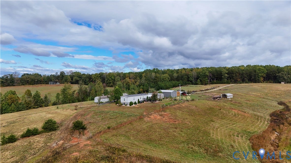290 Western Lane, Appomattox, Appomattox, VA 24522 Aerial perspective of expansive acreage featuring open rolling topography, mature tree lines, and multiple detached outbuildings