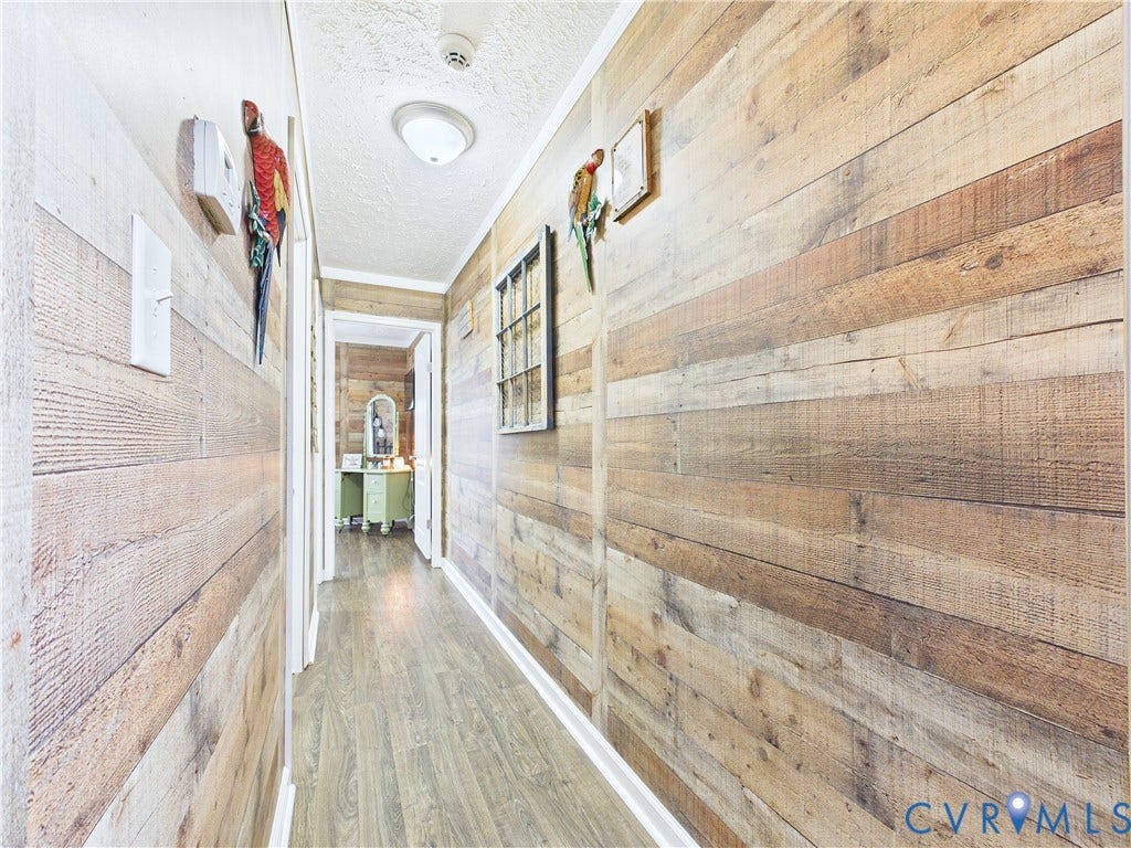 290 Western Lane, Appomattox, Appomattox, VA 24522 Hallway featuring horizontal wood-plank wall treatments and wood-finish flooring