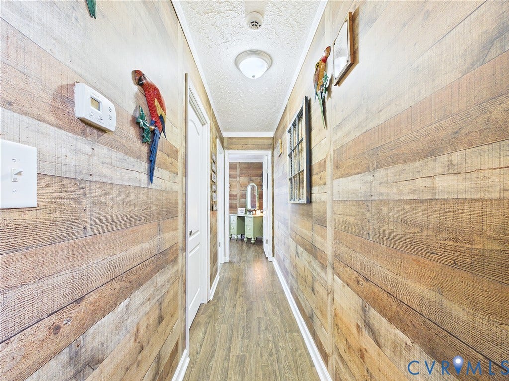290 Western Lane, Appomattox, Appomattox, VA 24522 Hallway featuring horizontal wood-plank wall paneling and wood-finish flooring