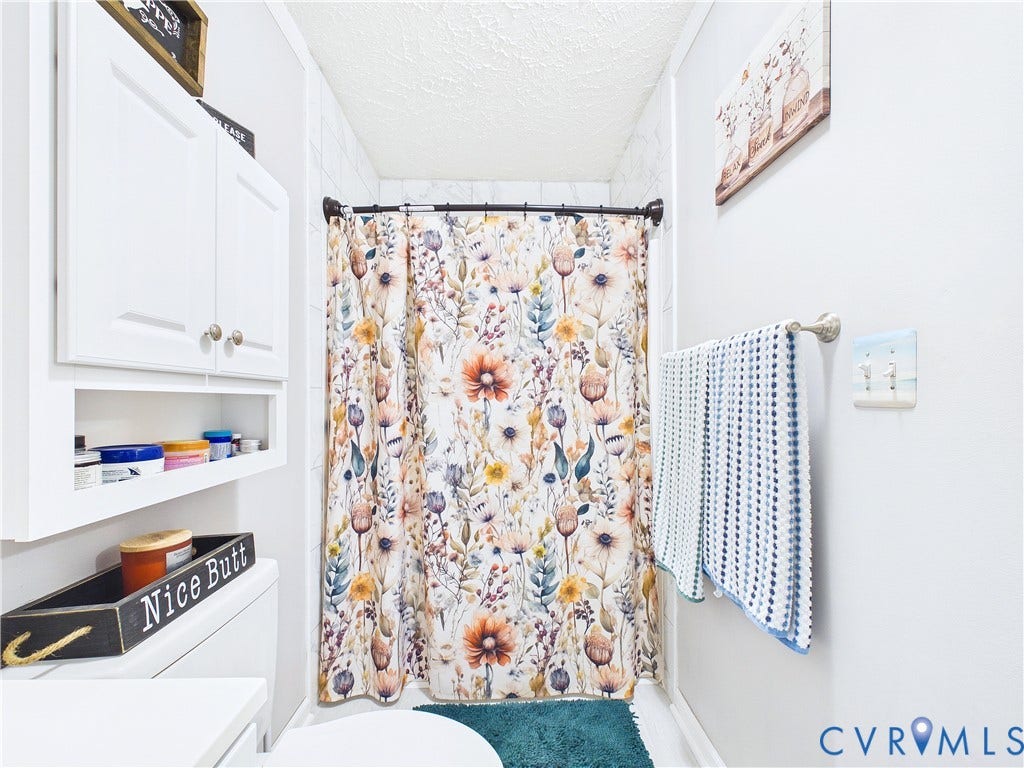 290 Western Lane, Appomattox, Appomattox, VA 24522 Built-in white cabinetry with open shelving and white tiled shower surround