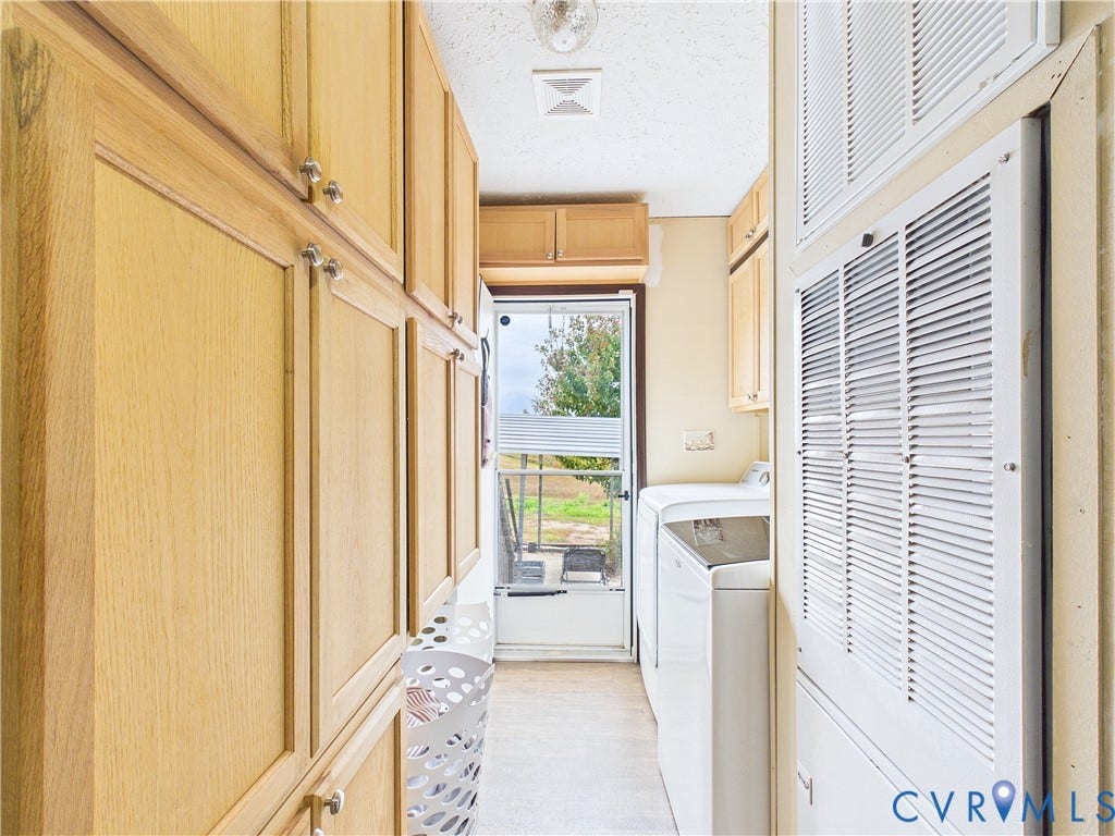 290 Western Lane, Appomattox, Appomattox, VA 24522 Full-length wood-finish cabinetry, metal louvered wall panels, and glass-paned exterior door with hardware