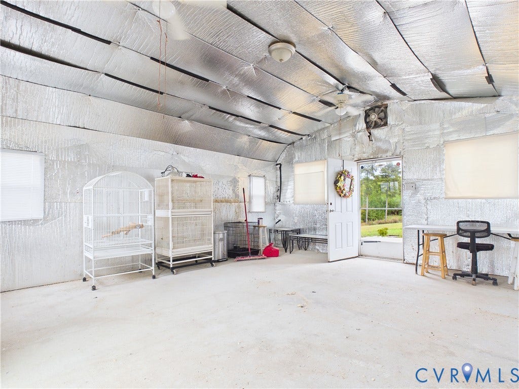 290 Western Lane, Appomattox, Appomattox, VA 24522 Multi-purpose structure featuring a metallic insulated ceiling and wall finish, concrete flooring, dual ceiling fans, multiple windows, and a walk-out exterior door