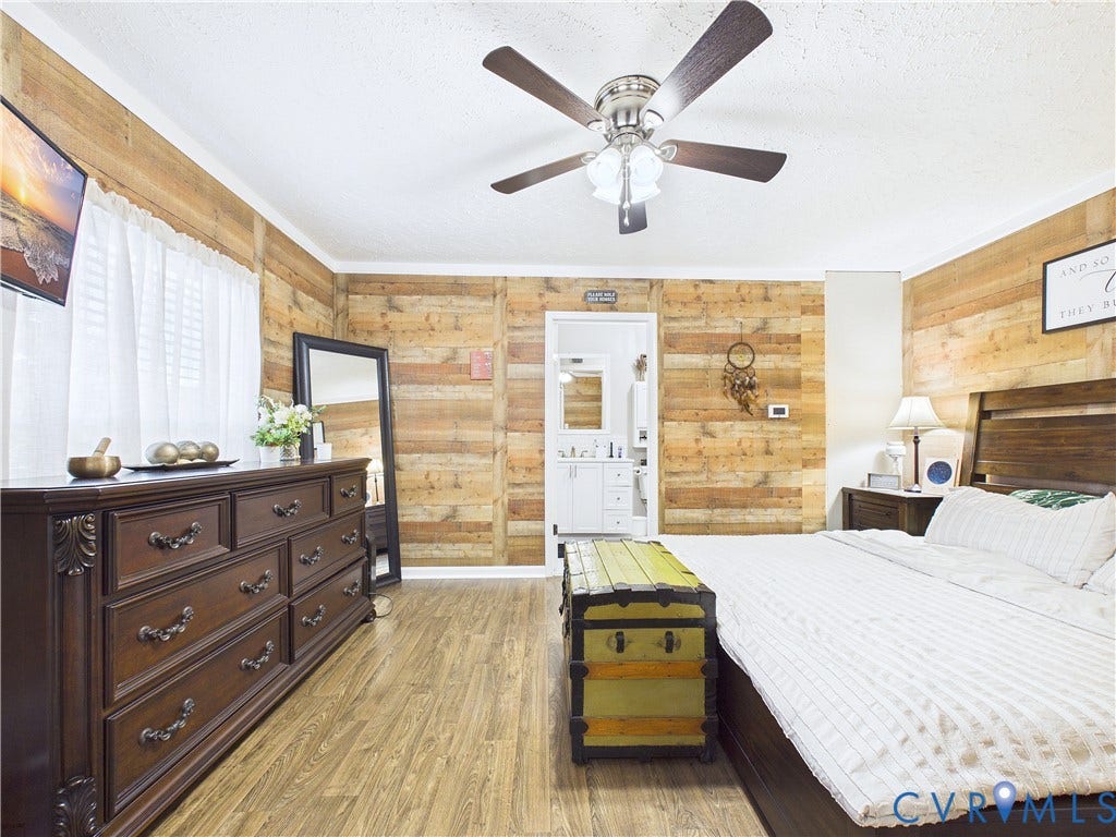 290 Western Lane, Appomattox, Appomattox, VA 24522 Horizontal wood plank wall paneling, wood-finish flooring, and a multi-light ceiling fan