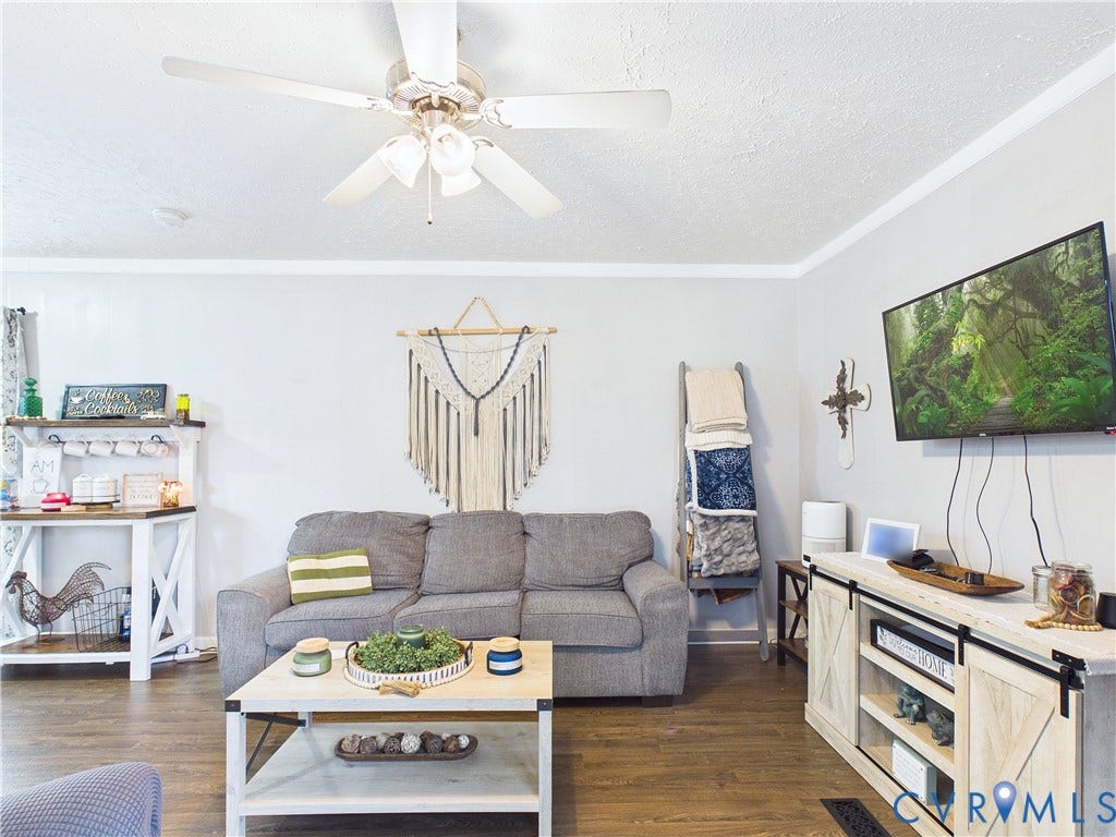 290 Western Lane, Appomattox, Appomattox, VA 24522 Living area featuring wood-finish flooring, white crown molding, and a central ceiling fan with integrated lighting